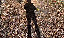 barefoot cutie teases feet while stroking cock outdoors this fall