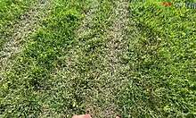 barefoot cutie teases feet while stroking cock outdoors this fall