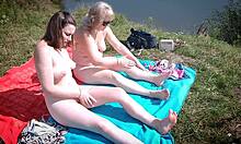 mature mommy and teen girl naked on public beach