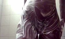 she's soaping up her tight wet pussy in the shower then fingers it hard homemade