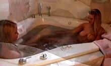 Curious tabby plays with dildo alongside lesbian bath time fun