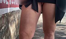 Ela lifts her skirt sans panties on street and bus... watch her tease in public with pigtails and socks.