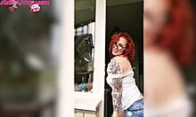 sexy redhead teen babe in wet t-shirt washes windows showing horny big tits homemade