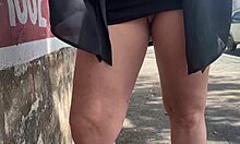 Ela lifts her skirt sans panties on street and bus... watch her tease in public with pigtails and socks.