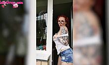 sexy redhead teen babe in wet t-shirt washes windows showing horny big tits homemade