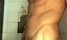 novinho strokes his thick cock hard in the steamy shower punheta