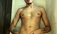 novinho strokes his thick cock hard in the steamy shower punheta
