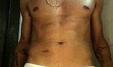 novinho strokes his thick cock hard in the steamy shower punheta