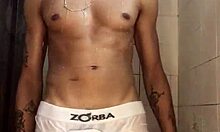 novinho strokes his thick cock hard in the steamy shower punheta
