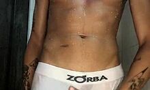 novinho strokes his thick cock hard in the steamy shower punheta