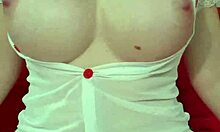 Pretty blonde in see-through dress bounces huge fake tits close-up amateur