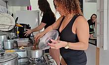 wife's friend bends over while wives cook lunch