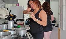 wife's friend bends over while wives cook lunch