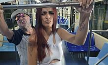 Stranger nears alone brunette passenger. Empty bus sparks tense roleplay.