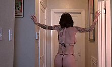 tattooed brunette amateur babe shows off big tits ass and bikini curves