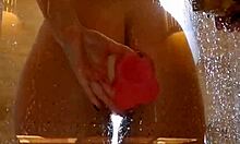 wet teen with juicy big ass spreads cheeks in shower fucking pink dildo closeup