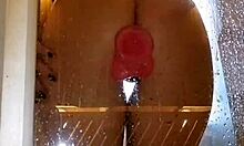 wet teen with juicy big ass spreads cheeks in shower fucking pink dildo closeup