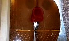 wet teen with juicy big ass spreads cheeks in shower fucking pink dildo closeup