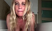 Blonde mature wife fists her wet prolapsed pussy lips in steamy shower solo
