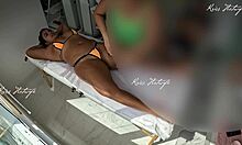 she slips tiny bikini into her big pussy during tanned massage