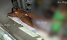 she slips tiny bikini into her big pussy during tanned massage