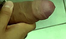 Horny cuck jerks off close-up in work bathroom watching his wife