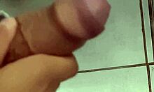 Horny cuck jerks off close-up in work bathroom watching his wife