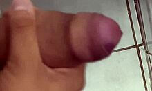 Horny cuck jerks off close-up in work bathroom watching his wife