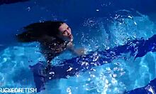 latex jessica bunny sinks into seductive underwater pool