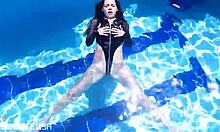 latex jessica bunny sinks into seductive underwater pool