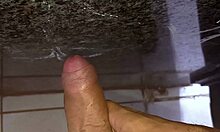 corno strokes off desperately in public bathroom close-up