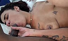 The slut takes double penetration from two huge black cocks screaming in orgasm