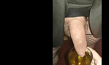 blindfolded bisexual crossdresser drinks his own pee fed by girlfriend close-up