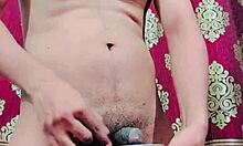 Watch this hairy femboy tease his limp penis then drink his own warm piss