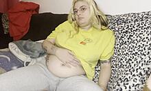 Chubby mommy gets swollen belly massaged on couch