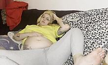 Chubby mommy gets swollen belly massaged on couch