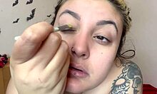 Cute topless kitten applies fetish makeup as sweet girl