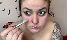 Cute topless kitten applies fetish makeup as sweet girl