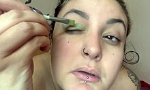 Cute topless kitten applies fetish makeup as sweet girl