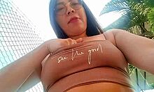I wake up horny and grab my big black dildo to masturbate outside