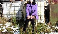 Cute milf smokes and shows naked pussy with dildo outdoors