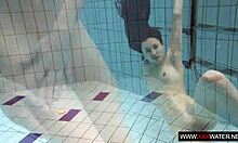 long haired brunette bathes cute in pool
