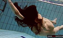 long haired brunette bathes cute in pool