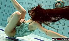 long haired brunette bathes cute in pool