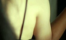 sexy indian girl in black satin dress poses alone
