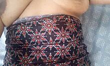 Housewife fingers her wet pussy while neighbor watches through window
