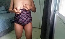 Housewife fingers her wet pussy while neighbor watches through window
