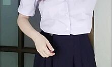 Thai student in uniform films herself for money.