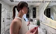Long legs nerdy college girl with a short pink skirt and pink panties show off in the bathroom