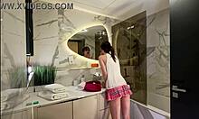 Long legs nerdy college girl with a short pink skirt and pink panties show off in the bathroom